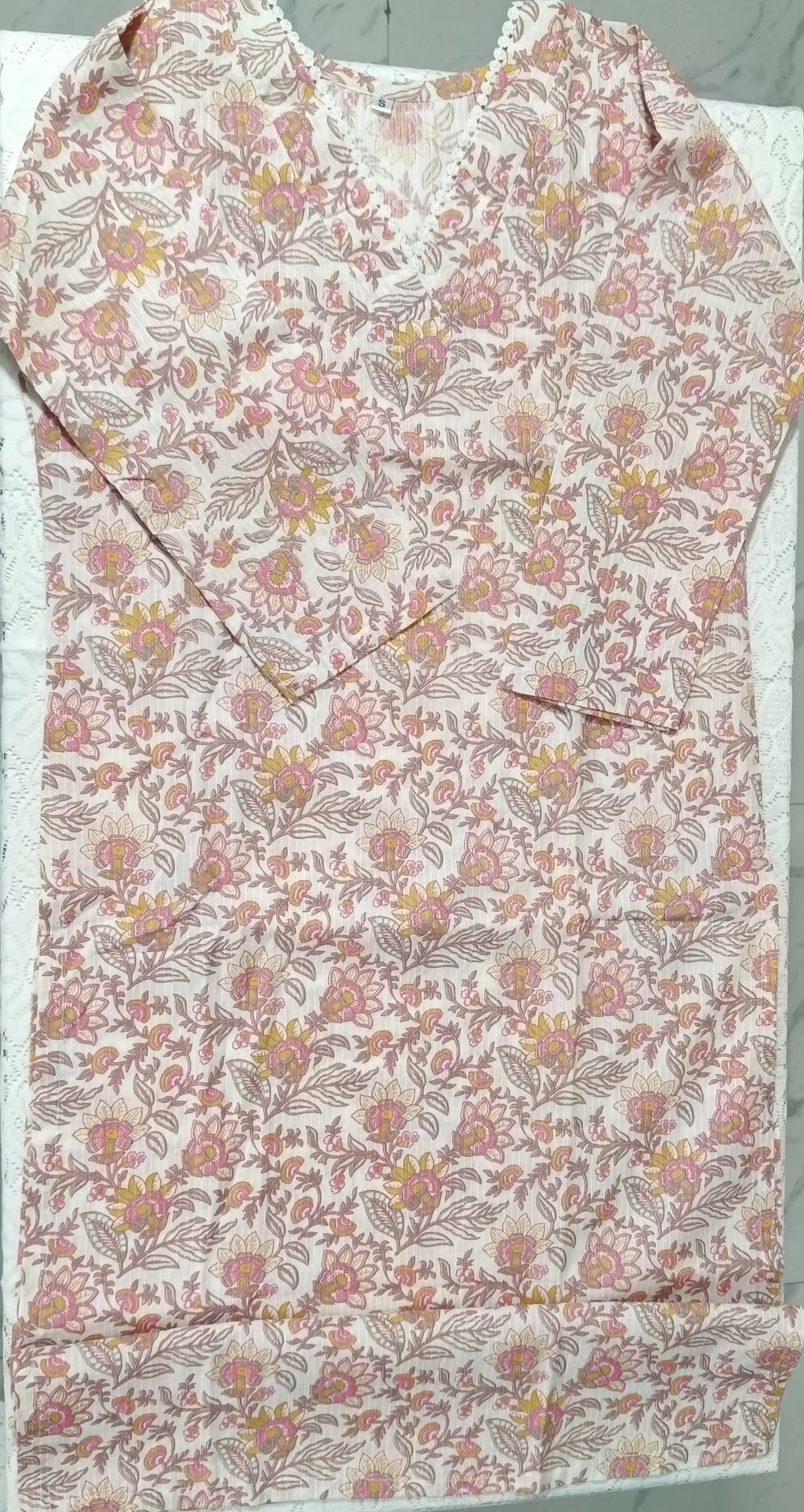 Floral patterned shirt on a white background