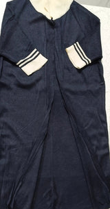 Navy blue garment with white accents on a light gray background