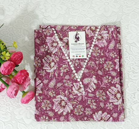 Floral-patterned fabric with a label on a white textured surface