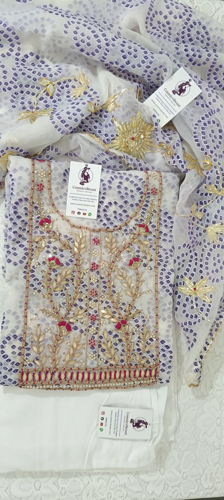 Embroidered fabric with floral patterns and brand tag on a white background