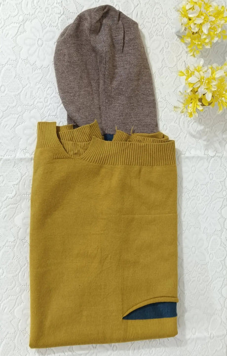 Mustard yellow sweater with a brown hood on a textured white background